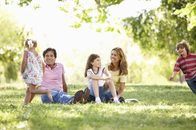 Family in lawn with professional lawn care