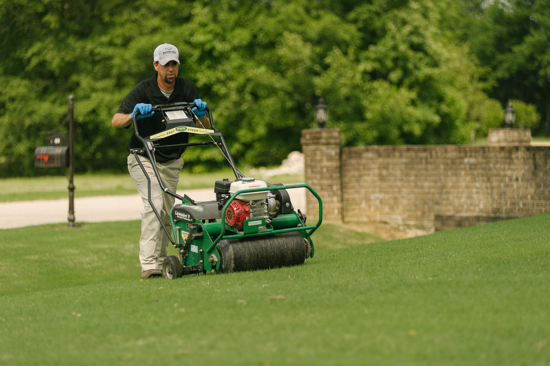 Lawn care services aerating lawn